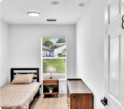 Interior view of a private resident room with natural light