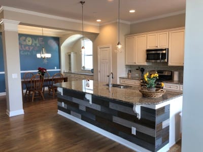 Bright kitchen area with wooden dining table and decor