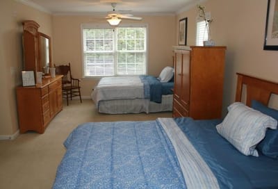 Interior view of a cozy resident room with two beds