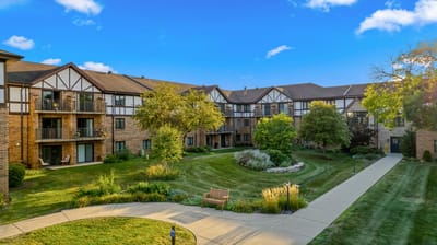 Outdoor courtyard with landscaped gardens and building facades