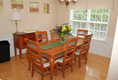Dining area with a table and flowers
