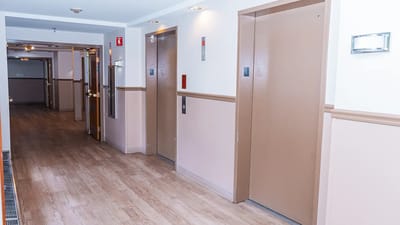 Hallway with elevators in a residential facility