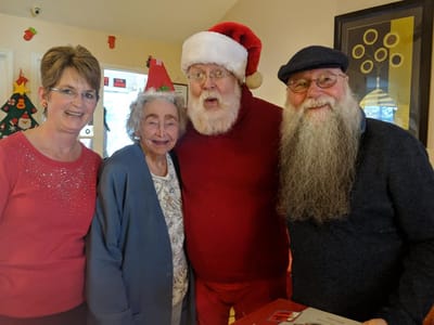 Residents celebrating with Santa Claus during a festive event