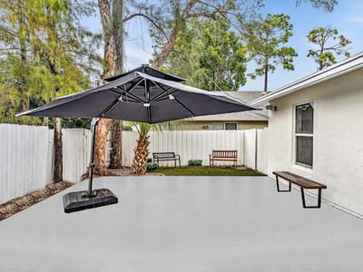 Outdoor patio area with umbrellas and benches