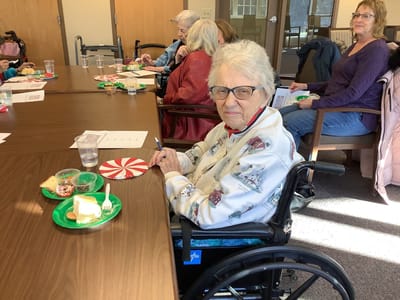 Resident enjoying a meal during an activity