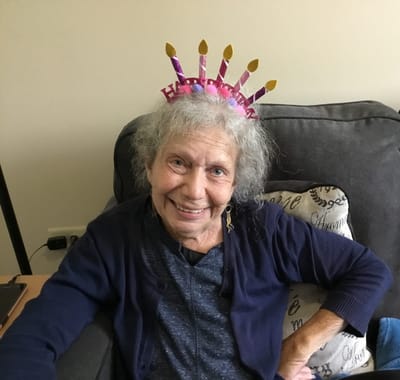 Resident celebrating with a birthday crown