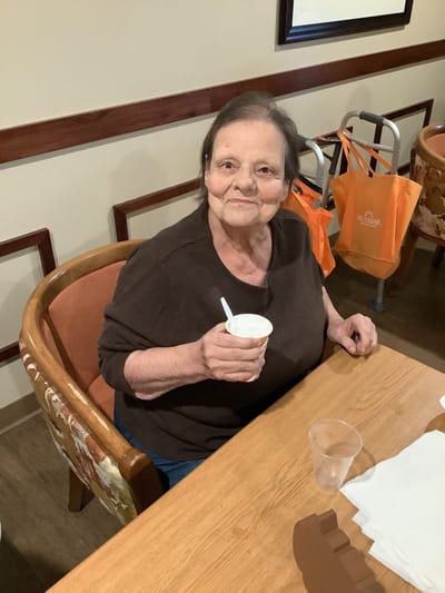 Resident enjoying a snack in the dining area