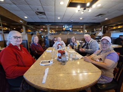 Residents enjoying a meal together in a dining area