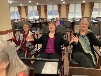Residents engaged in a lively group activity