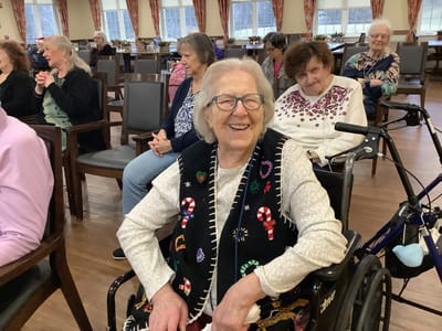 Happy resident in a social gathering setting