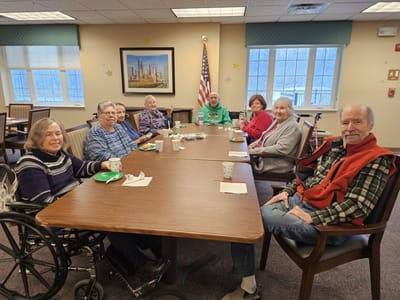 Residents enjoying a social gathering in a common area
