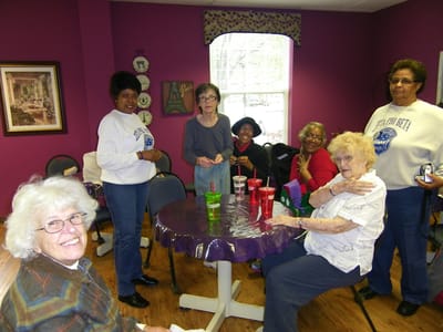Residents engaged in an activity in a colorful common area
