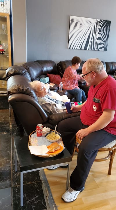 Caregiver interacting with a resident in a common area