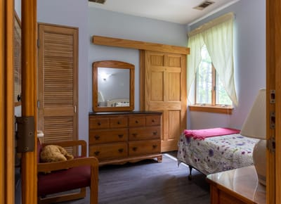 Cozy bedroom with wooden furniture and natural light