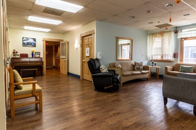 Cozy lobby with seating and a piano at Winter Growth