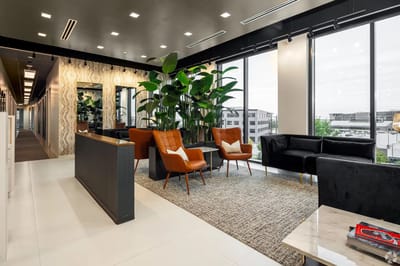 A stylish common area with seating and plants