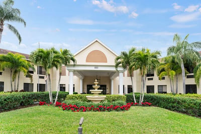 Exterior view of Volante Senior Living with fountain and landscaping