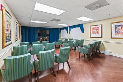 Interior room with arranged seating and movie posters