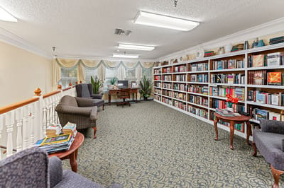 Cozy reading area with bookshelves and seating