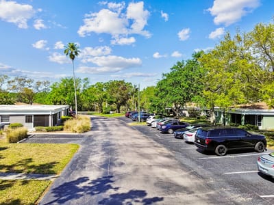 Outdoor view of the parking area and surrounding greenery