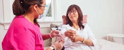 Nurse providing care to a senior resident