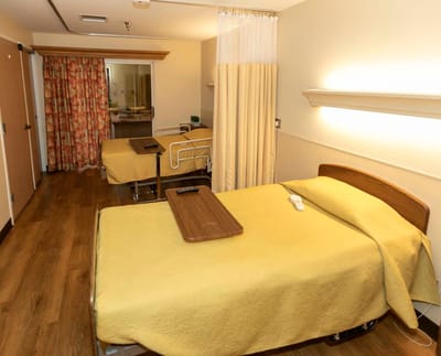 Interior view of a shared resident room with beds
