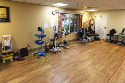 Well-equipped rehabilitation exercise room with various machines