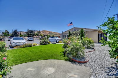 Exterior view of Palm View Pleasant Living with landscaped garden