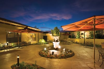 Serene outdoor garden area with seating and a fountain