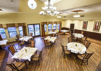 Well-decorated dining room with several tables and chairs