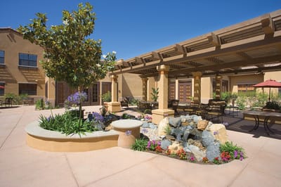 Outdoor garden space with seating and water feature