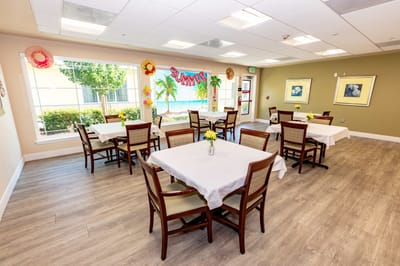 Bright dining room with tables and summer decorations