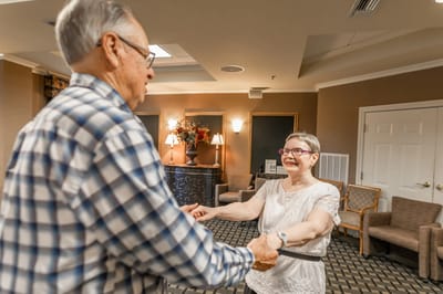 Residents enjoying a dance in a common area