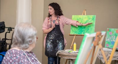 Art class session with an instructor and residents