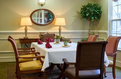 Interior dining room with a table set for a meal