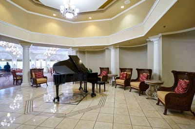 Bright common area with a piano and seating