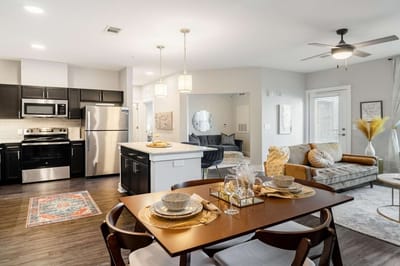 Modern interior of a resident's suite with kitchen and living area