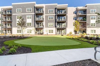 Outdoor space with well-maintained landscaping near facility.