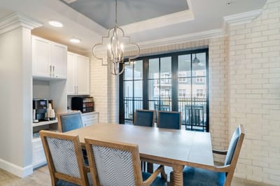 Well-lit dining area with seating and a view