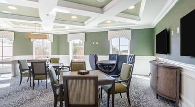 A bright common area with tables and chairs