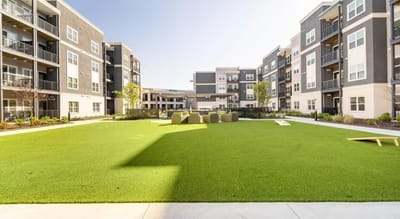 Outdoor space with green lawn and seating area
