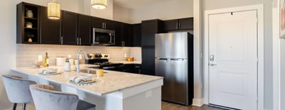 Modern kitchen interior with bar seating