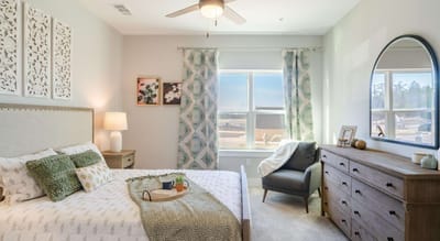 Cozy resident room with a bed and natural light