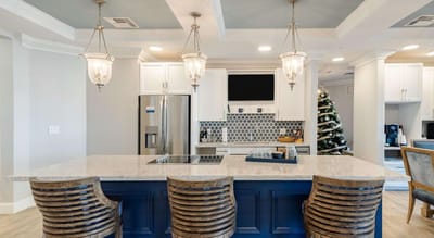 Modern kitchen interior with seating at a large island