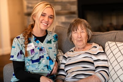 Caregiver with resident in a cozy common area