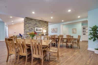 Common area seating with wooden tables and chairs