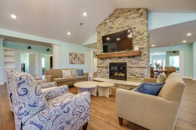 Cozy lounge area with a fireplace and seating