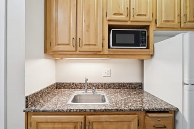 Well-equipped kitchen countertop in a resident unit.