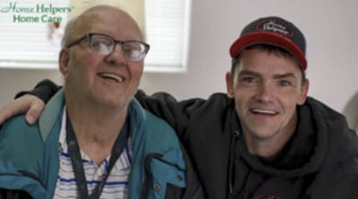 Senior resident enjoying time with staff member