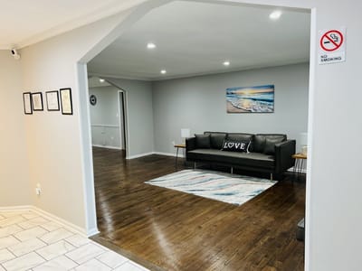 Bright communal area with a sofa and artwork